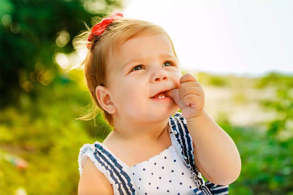 Toddler sucking their thumb