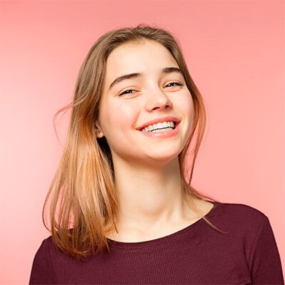 A teenager smiling